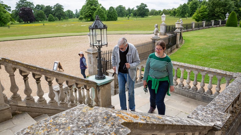 Visitors walking into the hall at Wimpole Estate, Cambridgeshire